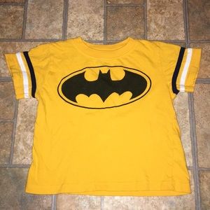 Yellow shirt with Batman symbol on the front
